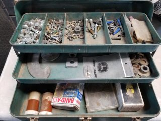 Used green metal tray with bolts, nuts, washers