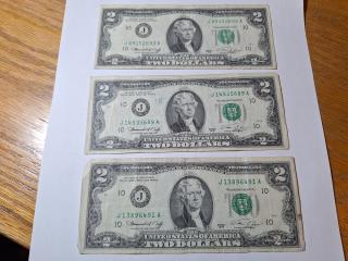 Three - $2 bills 