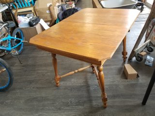 Solid wood table, approx 28 by 34 by 46 inches 