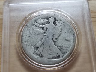 Silver Walking Liberty half dollar, date hard to read 
