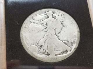 Silver Walking Liberty half dollar, date hard to read 