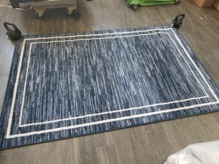 New 6 foot by 4 foot area rug 