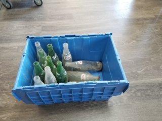 Tote with old pop bottles 