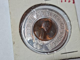 1949-D wheat penny,  in B and C Steel Co. token