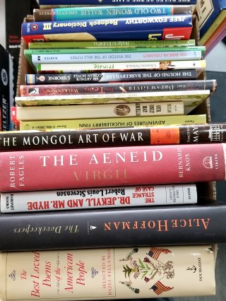 Stack of used books in box