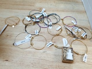 New Metal bangle bracelets on wood floor