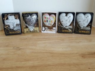 5 heart ornaments in boxes
