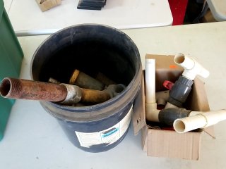 Bucket of pipes and fittings