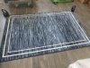 Item #10 — New 6 foot by 4 foot area rug