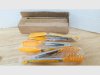 Item #145 — Yellow Plastic Tongs Set in Box