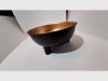 Item #628 — Black & Gold Footed Metal Bowl, 10 inch across