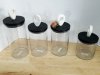 Item #208 — New Four Glass Storage Jars with Lids, Tallest is 12 in