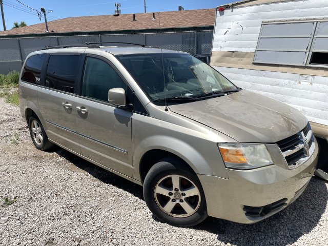 Item #4 — 2008 Gold Dodge Caravan	26-00605