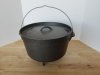 Item #58 — CAST iron cooker, footed, approx 15 by 9 inch