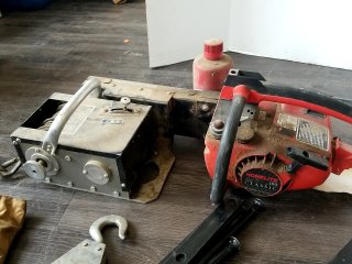 Item #262 — HOMELITE chainsaw and winch lot photo 2 of 6