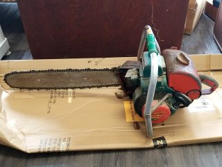 Item #265 — HOMELITE 700 Chainsaw, 22 inch blade, sells as is photo 1 of 4