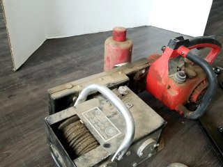 Item #262 — HOMELITE chainsaw and winch lot photo 4 of 6