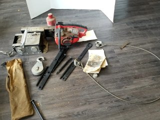 Item #262 — HOMELITE chainsaw and winch lot photo 1 of 6