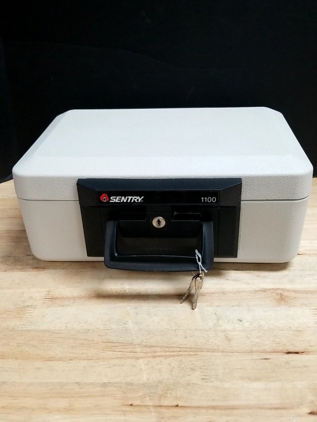 Item #9 — Sentry 1100 Fireproof Safe with keys, approx 14 by 10 by 7 inch photo 1 of 3