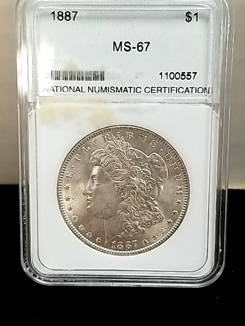 Item #117 — 1887 Morgan silver dollar photo 1 of 3