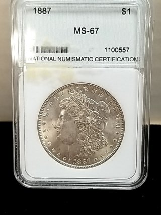 Item #117 — 1887 Morgan silver dollar photo 1 of 3