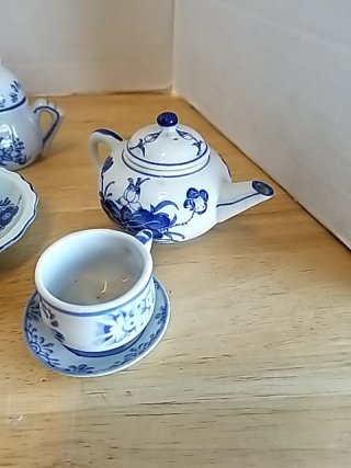 Item #157 — Blue Floral Porcelain Tea Set, tallest approx 4 inch photo 2 of 5