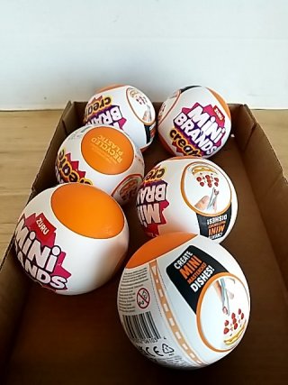 Item #88 — New Mini Brands toy balls in box