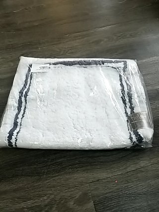 Item #92 — White Fleece Throw Blanket 34 by 21 inch photo 1 of 2