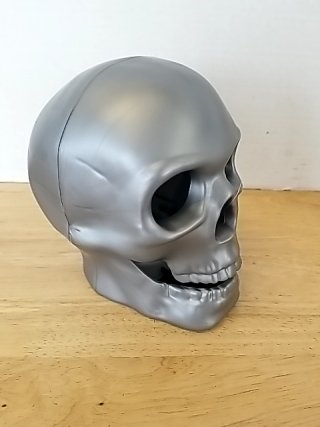 Item #94 — New color changing skull, approx 7 inch tall photo 2 of 2