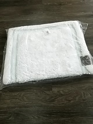 Item #88 — New White Plush Bath Rug in Plastic 24 by 40 inch photo 1 of 2