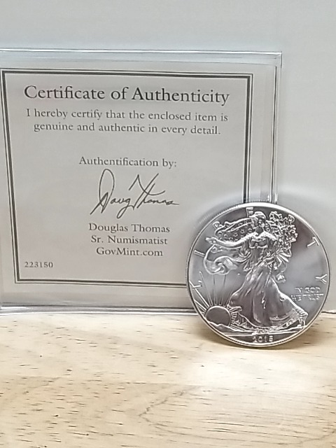 Item #40 — 2015 American Eagle Silver Dollar with COA photo 1 of 3