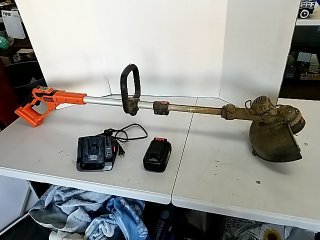 Item #158 — BLACK & Decker Weed Trimmer, charger, battery photo 1 of 4