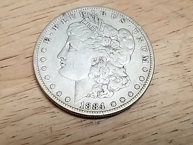 Item #8 — 1884 P Morgan Silver Dollar Coin photo 1 of 3