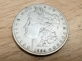 Item #8 — 1884 P Morgan Silver Dollar Coin photo 2 of 3