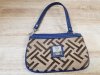 Item #38 — Brown Geometric Wristlet Purse, approx 8 in