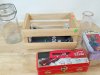 Item #654 — Assorted Tins, Jars, and Wooden Crate