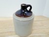 Item #64 — Vintage Stoneware Jug, 8 in, flea bite chips