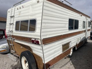 Item #5 — 1977 Tan Monarch Motor Home - 25-03200