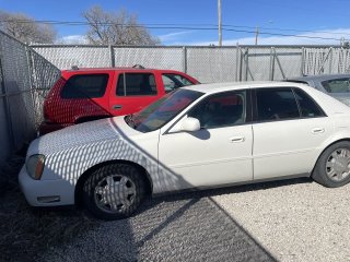 Item #4 — 2005 White Cadillac Deville     26-00024